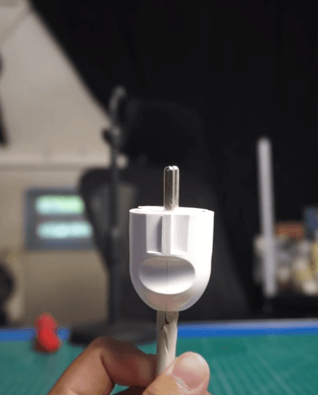 Comparison of flat plug and round ground plug both use 2 pins