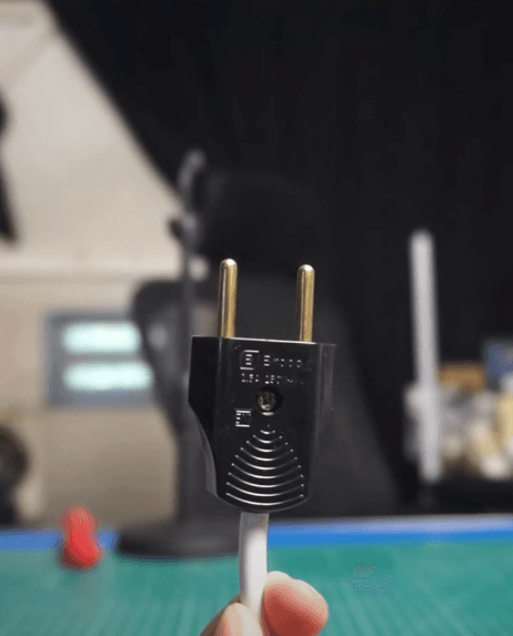 Comparison of flat plug and round ground plug both use 2 pins